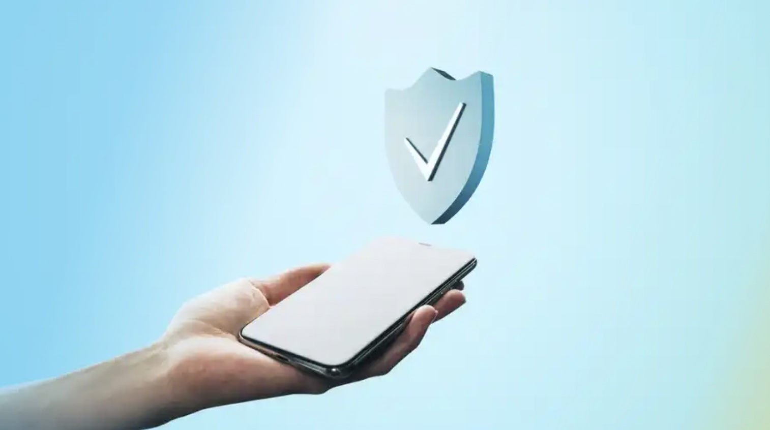 A phone being held with a checkmark hovering above it.
