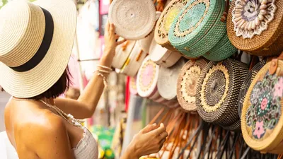 Woman In Hat Is Coming To Street Market And Choosing