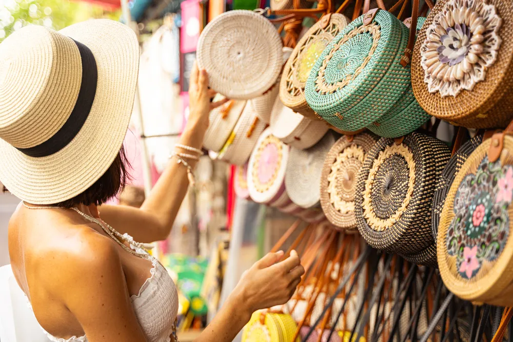 Woman In Hat Is Coming To Street Market And Choosing