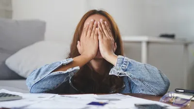 Young Asian Woman Cover Her Face After Stressed With Monthly