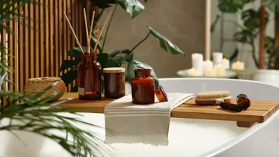 Wooden Bath Tray With Open Book Candle And Body Care