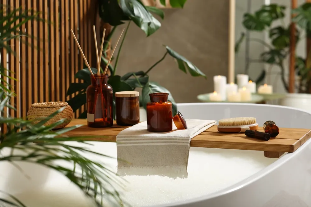 Wooden Bath Tray With Open Book Candle And Body Care