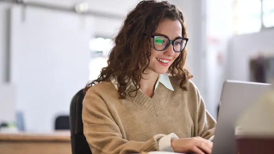 Young Happy Professional Business Woman Worker Employee Sitting At Desk