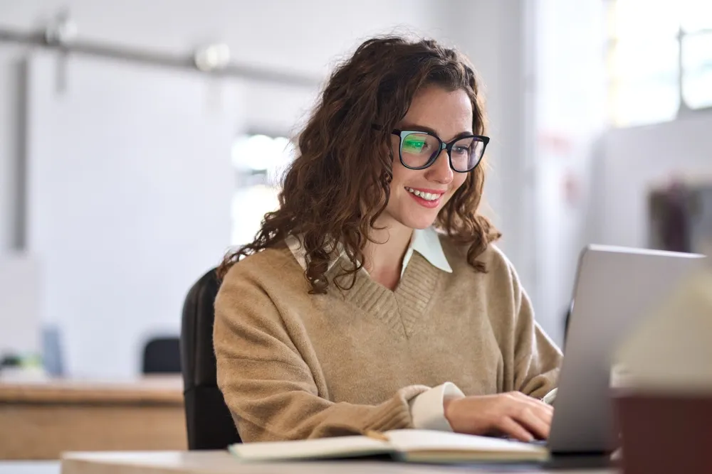 Young Happy Professional Business Woman Worker Employee Sitting At Desk