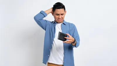 No Money. Depressed Young Asian Man In Casual Shirt Looking